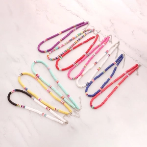Detail view of 10 colorful 6mm Heishi clay bead choker necklaces with lobster clasps