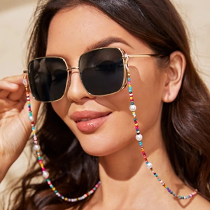 Detail of colorful seed beads and faux pearls on eyewear chain for square sunglasses