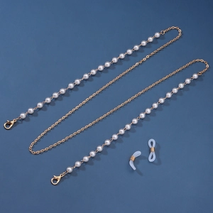 Detail view of gold chain with symmetrical pearls and lobster clasps for glasses and masks