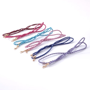 Close-up of colorful braided leather cords with golden lobster clasps for eyewear