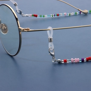 Macro shot of colorful beaded eyeglass chain with silver lobster clasp and silicone loop