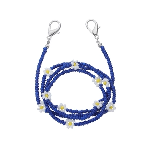 Close-up of blue beaded eyewear chain featuring white daisy flowers and silver lobster clasps