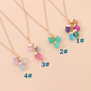 Detail view of colorful crystal gemstone pendants with gold alloy chains in four styles