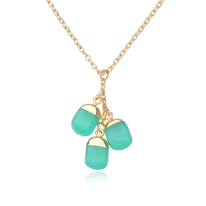 Detail of three green pebble pendants on a delicate gold chain with polished finish
