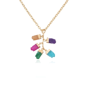 Detail showing five colorful irregular raw gemstones on a gold plated chain necklace