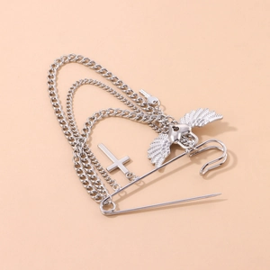 Silver punk pin brooch with layered chains featuring a cross and winged heart charm