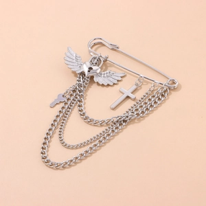 Silver punk safety pin brooch with winged heart, cross pendant, and layered chains