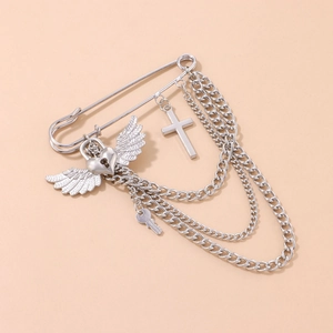 Silver punk safety pin brooch featuring heart wings, cross charm and layered chains