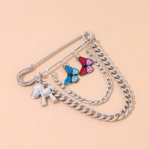 Silver safety pin brooch with blue enamel butterflies, metal chains and a pony charm