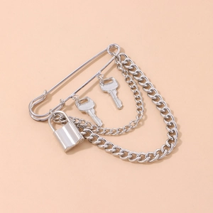 Silver punk style lock and key brooch with double curb chains and safety pin