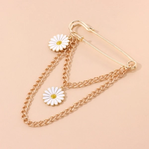 Elegant gold safety pin brooch with double chains and white daisy enamel flower pendants