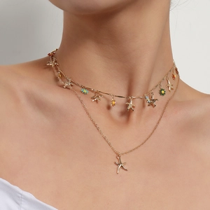 Hawaiian double-layered gold necklace with starfish pendants and colorful enamel flowers