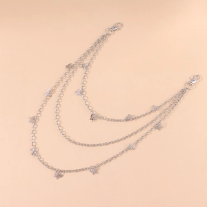 Detailed view of silver triple-layered chain with hollow butterfly pendants and lobster clasps