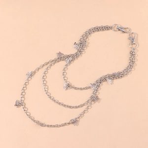 Detailed view of triple-layered silver butterfly waist chain with lobster clasps