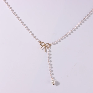 Elegante Y-Perlenhalskette mit goldener Schleife und Quasten für Damen