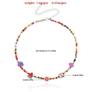 Colorful seed bead necklace with fruit charms featuring lemon and watermelon motifs