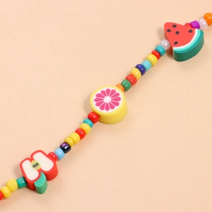 Handmade seed bead necklace featuring colorful summer fruit charms like watermelon and orange