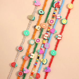 Colorful seed bead necklace with mixed fruit charms like watermelon and lemon charms