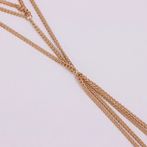 Minimalist multi-layered gold metal body chain jewelry with a punk-inspired design