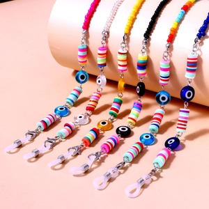 Kleurrijke boho brilketting met kleikralen, bloemen en evil eye bedeltjes voor dames