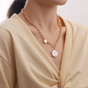 Gold chunky chain necklace with mother of pearl pendant and OT toggle clasp