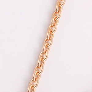 Macro shot of high-polished golden alloy chain links with glossy metallic finish