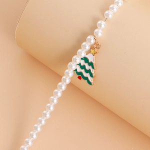 Detailed view of Christmas tree pendant with imitation pearl chain and colorful enamel finish