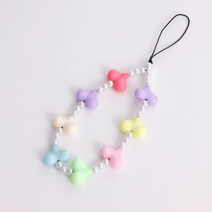 Detail of beaded phone lanyard featuring colorful acrylic heart and pearl beads