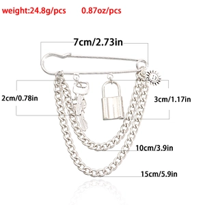 Silver punk multi-layer chain brooch with key and padlock charms on a large safety pin