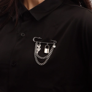 Silver punk safety pin brooch with key, padlock, and sun pendants on double chains
