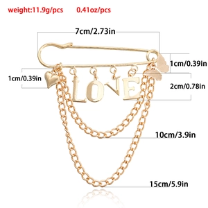 Gold love heart tassel brooch pin for women featuring letter charms and long metal chains