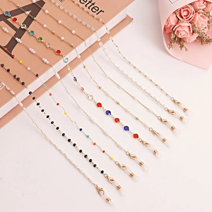 Detailed assortment of pearl and crystal eyewear chains with gold lobster clasps