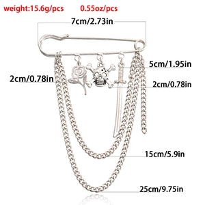 Silver skull brooch with tassels, rose and sword charms in punk style for women