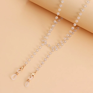 Detail of beaded eyewear chain with frosted pearls, golden links and anti-slip rings