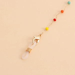 Detail of colorful beads and gold metal chain with lobster clasp for glasses and masks