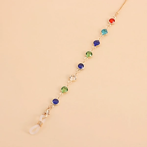 Detailed view of colorful crystal evil eye charms and non-slip silicone loops on gold chain