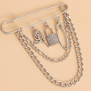 Silver safety pin brooch with rose pendant, rhinestone lock, and dangling chains