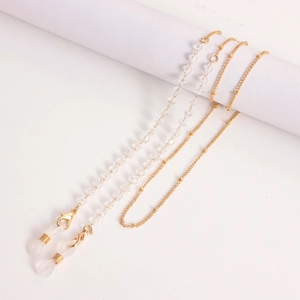 Detail of colorful crystal beads on a gold eyeglass chain with secure silicone loops