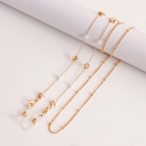 Gouden brillenketting met witte parels en sterren, met kreeftensluitingen en siliconen ringen