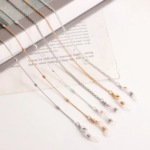 Detail of gold and silver beaded eyeglass chains with metal lobster clasps and loops