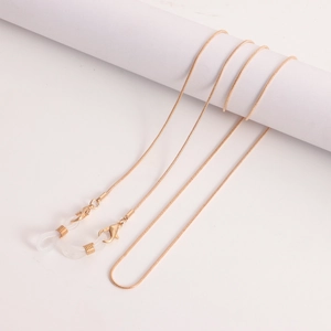Detailed close-up of golden snake chain with lobster clasps and silicone loops for glasses