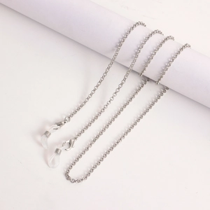 Detailed macro view of silver metal eyeglass chain with lobster clasps and silicone loops