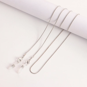 Silver snake chain glasses strap with lobster clasps and clear silicone ends on white stand