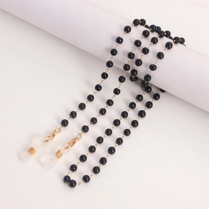 Chaîne perlée pour lunettes et masques avec perles noires, fermoirs dorés et boucles silicone