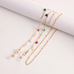 Golden eyewear chains with colorful enamel hearts and small cross charms for women