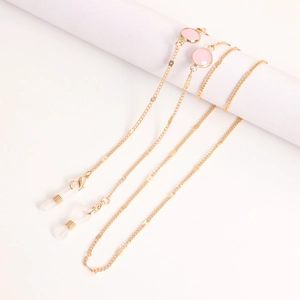 Chaîne à lunettes dorée avec pierres roses rondes et boucles antidérapantes en silicone