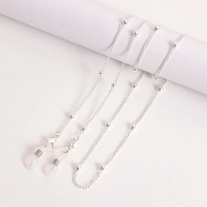 Detailed view of silver beaded metal eyewear chain with silicone loops and lobster clasps