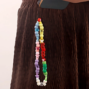 Handmade colorful beaded phone charm with acrylic stars, hearts and butterfly elements