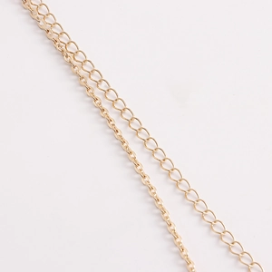 Detail of bohemian gold-plated layered chain links for starfish turquoise waist belts