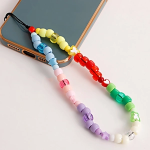 Colorful beaded phone strap with acrylic hearts and stars on a blue smartphone